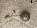 with a unique spherical shape, perfect for modern and traditional spaces.