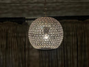 Stylish Moroccan brass pendant light hanging elegantly, adding a touch of sophistication to any room.