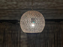 viewed from below, showcasing its stunning perforated pattern.